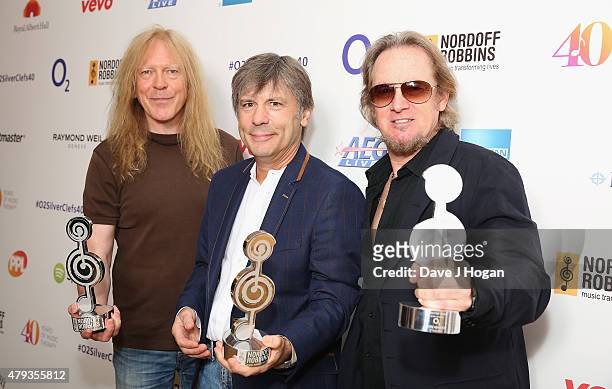 Janick Gers, Bruce Dickerson and Adrian Smith from Iron Maiden with their O2 Silver Clef award at the Nordoff Robbins O2 Silver Clef awards at the...