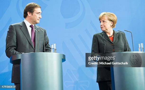 Pedro Passos Coelho, Prime Minister of Portugal, and German Chancellor Angela Merkel attend a press conference on March 18, 2014 in Berlin, Germany....
