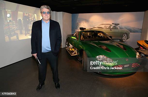 Vic Armstrong poses in front of the Jaguar XKR from 'Die Another Day' ahead of the opening of the Bond In Motion exhibition at the London Film Museum...