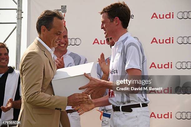 Andre Konsbruck, Director of Audi UK, Prince William, Duke of Cambridge, and Ben Vestey attend the Audi Polo Challenge 2015 at Cambridge County Polo...