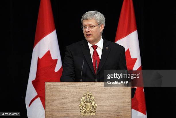 Canada's Prime Minister Stephen Harper speaks during the welcoming ceremony to the last of Canada's troops from Afghanistan as they returned to...
