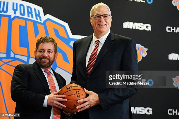 James Dolan, L, Executive Chairman of Madison Square Garden, stands with Phil Jackson during the press conference to announce Jackson as President of...