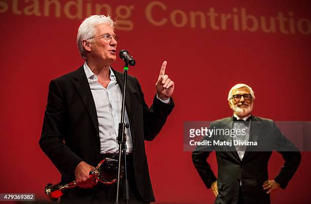 Actor Richard Gere deliveres a speech as he receives the Crystal Globe for Outstanding Artistic Contribution to World Cinema at the opening ceremony...