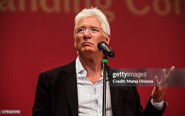 Actor Richard Gere deliveres a speech as he receives the Crystal Globe for Outstanding Artistic Contribution to World Cinema at the opening ceremony...