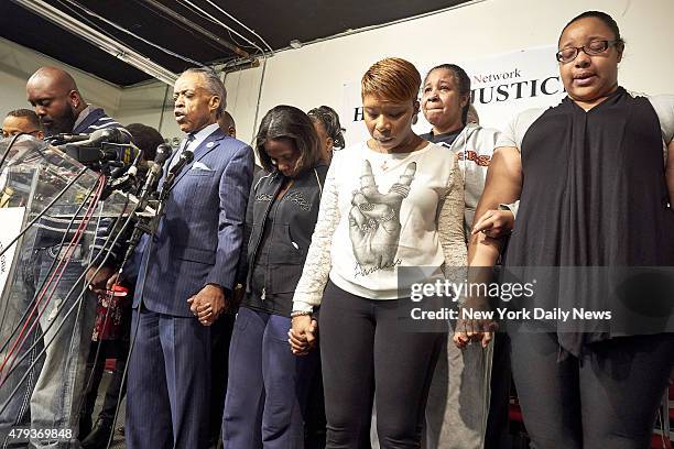 Michael Brown, father of shooting victim Michael Brown, Rev. Al Sharpton, Kimberly Michelle Ballinger, domestic partner of shooting victim Akai...