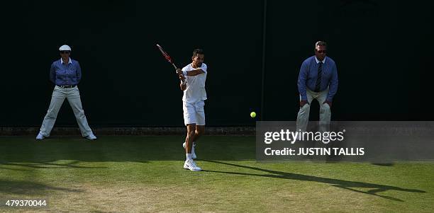 Colombia's Santiago Giraldo returns against US player Denis Kudla during their men's singles third round match on day five of the 2015 Wimbledon...