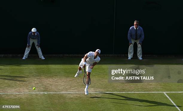 Player Denis Kudla serves against Colombia's Santiago Giraldo during their men's singles third round match on day five of the 2015 Wimbledon...