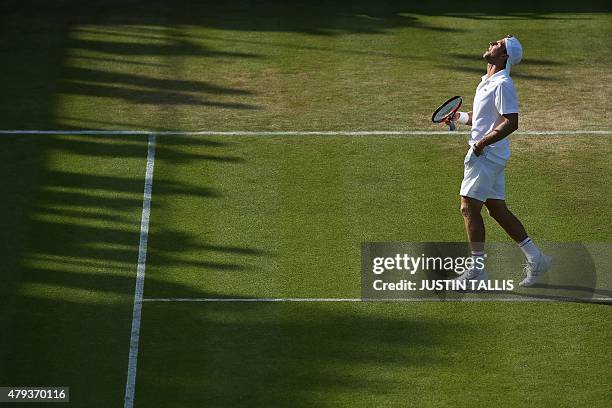 Player Denis Kudla reacts after a point against Colombia's Santiago Giraldo during their men's singles third round match on day five of the 2015...