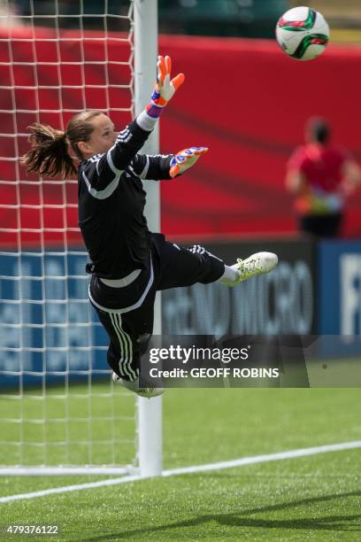 German goalkeeper Laura Benkarth dives for the ball during the team's training session at the 2015 FIFA Women's World Cup in Edmonton on July 3,...
