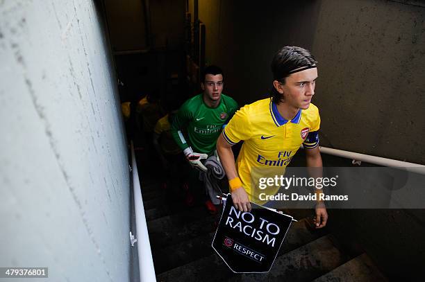 Kristoffer Olsson of Arsenal leads his team out onto the pitch prior to the UEFA Youth League Quarter FInal match between FC Barcelona U19 and...