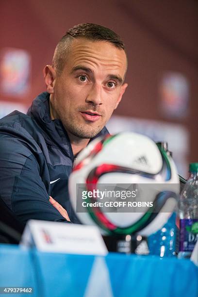 England's head coach Mark Sampson speaks during a press conference at the FIFA Women's World Cup in Edmonton on July 3, 2015. England meets Germany...