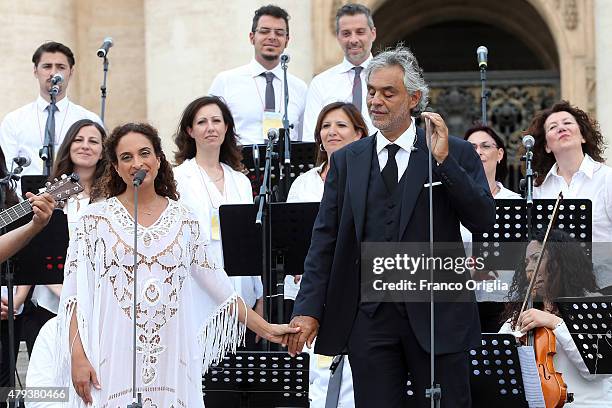 Italian tenor Andrea Bocelli and Israeli singer Noa perform during an audience held by Pope Francis in St Peter's Square for members of the Renewal...