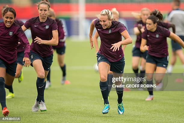 England's Toni Duggan races with her teammates during their final training session at the FIFA Women's World Cup in Edmonton, on July 3, 2015....