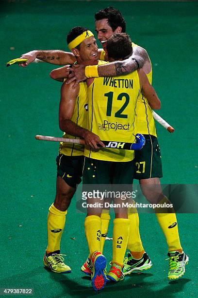 Jacob Whetton of Australia celebrates with team mates after he scores a goal during the Fintro Hockey World League Semi-Final match between Australia...