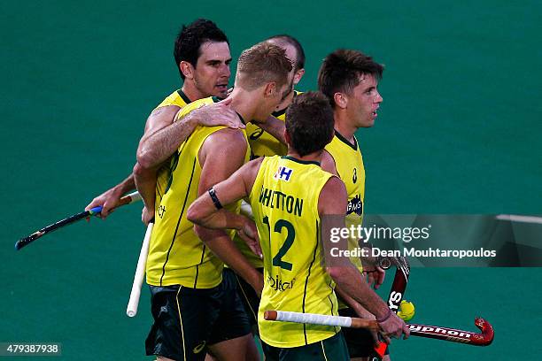 Daniel Beale of Australia celebrates with team mates after he scores a goal during the Fintro Hockey World League Semi-Final match between Australia...