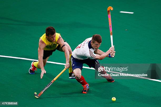 Tristan White of Australia attempts to stop Sam Ward of Great Britain shooting on goal during the Fintro Hockey World League Semi-Final match between...