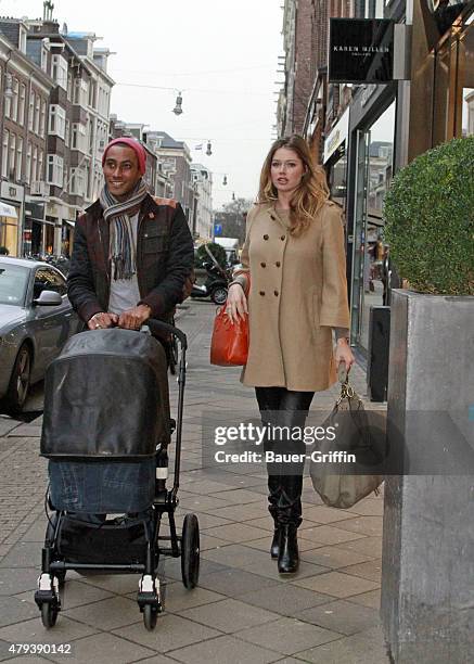 Model Doutzen Kroes and husband DJ Sunnery James are seen with their newborn son Phyllon Joy Gorre on February 15, 2011 in Amsterdam, Netherlands.