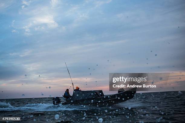 Yupik men head back to their village after a day of salmon fishing on July 1, 2015 in Newtok, Alaska. Newtok has a population of approximately of 375...