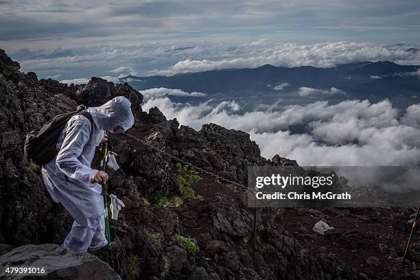 Climber descends along a trail on Mt Fuji on July 2, 2015 in Fujiyoshida, Japan. Mt Fuji is Japan's highest peak and was named a UNESCO Heritage site...