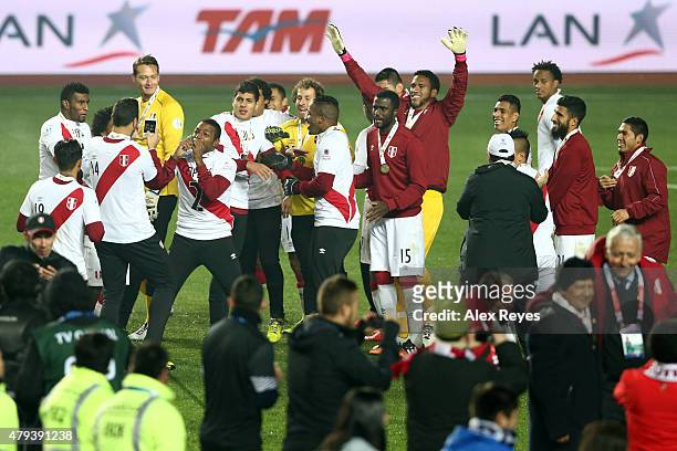 Jair Cespedes of Peru kisses his third place medal while his teammate Claudio Pizarro takes a photo the 2015 Copa America Chile Third Place Playoff...