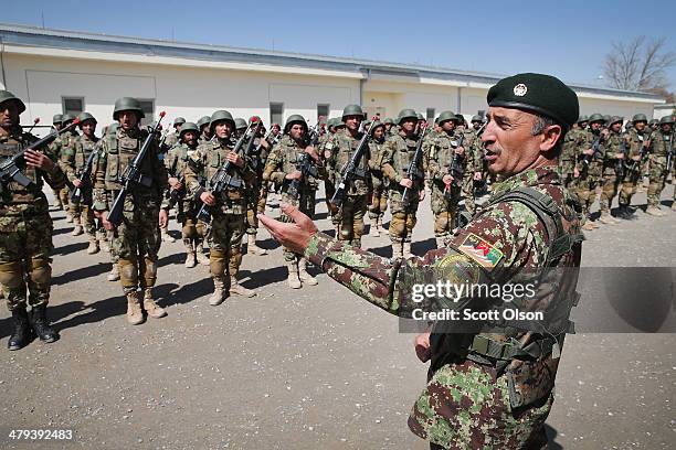 Soldiers with the Afghan National Army graduate from basic training during a ceremony at the ANA's Combined Fielding Center on March 18, 2014 in...