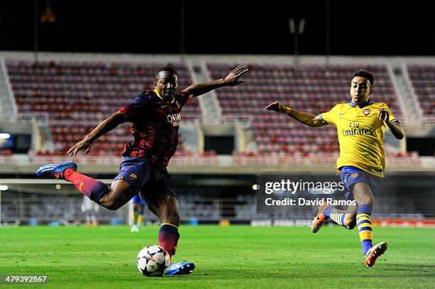 Adama Traore of FC Barcelona assists his teammate Wilfrid Kaptoum to score his team's third goal during the UEFA Youth League Quarter FInal match...