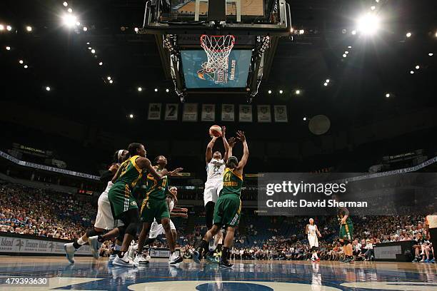 Monica Wright of the Minnesota Lynx shoots against Renee Montgomery of the Seattle Storm on July 3, 2015 at Target Center in Minneapolis, Minnesota....