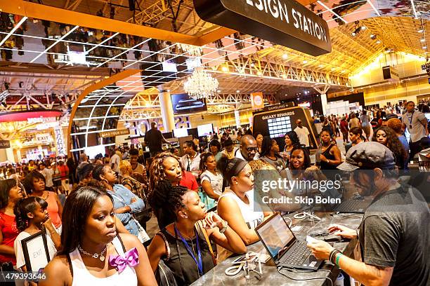 Festivalgoers attend Samsung Galaxy Experience at the 2015 ESSENCE Festival on July 3, 2015 in New Orleans, Louisiana.