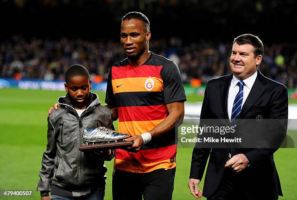 Former Chelsea player Didier Drogba of Galatasaray and son Isaac on the pitch with Ron Gourlay, Chief Executive of Chelsea prior to the UEFA...