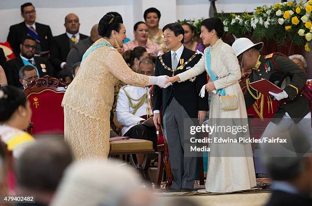 Crown Prince Naruhito and Crown Princess Masako of Japan shakes hands at the official coronation ceremony for King Tupou VI of Tonga and Queen...