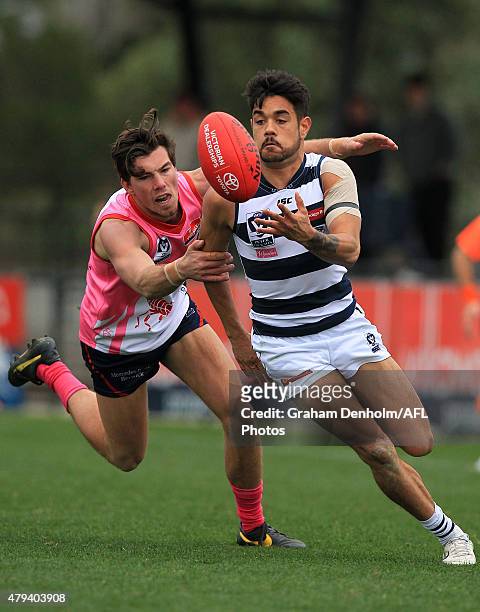 Zachary Bates of the Cats catches the ball under pressure from the Scorpions defence during the round 12 VFL match between the Casey Scorpions and...