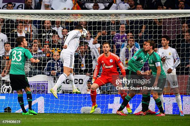 Cristiano Ronaldo of Real Madrid directs a header at the goal of Ralf Fahrmann of Schalke during the UEFA Champions League Round of 16, second leg...