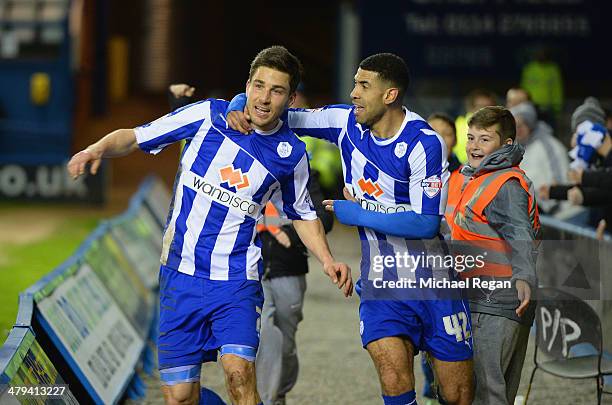 Lewis Buxton of Sheffield Wednesday celebrates scoring to make it 3-0 with team mate Leon Best during the Sky Bet Championship match between...