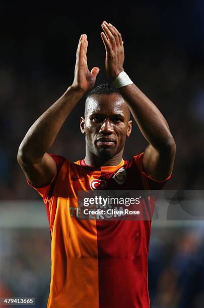 Didier Drogba of Galatasaray applauds the crowd after the UEFA Champions League Round of 16 second leg match between Chelsea and Galatasaray AS at...