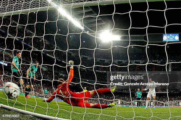 Goalkeepr Ralf Fahrmann of Schalke dives in vain as Alvaro Morata of Real Madrid scores his team's third goal during the UEFA Champions League Round...