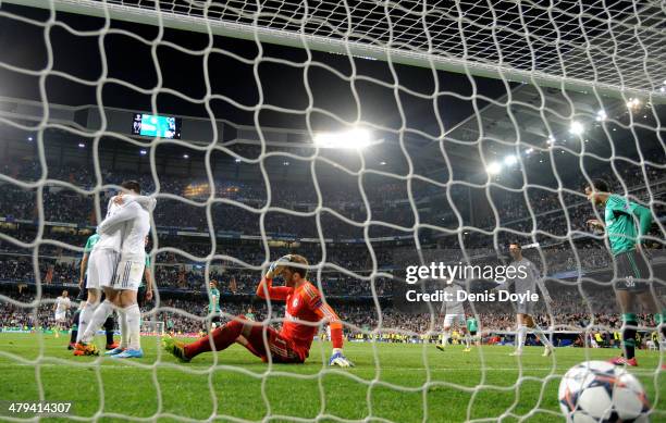 Alvaro Morata of Real Madrid is congratulated by teammate Gareth Bale after scoring his team's third goal, whilst dejected goalkeeper Ralf Fahrmann...