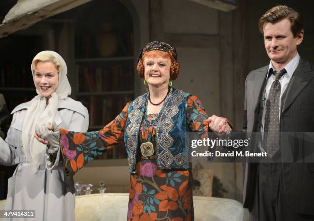 Janie Dee, Dame Angela Lansbury and Charles Edwards bow at the curtain call during the press night performance of "Blithe Spirit" at the Gielgud...