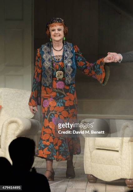 Dame Angela Lansbury bows at the curtain call during the press night performance of "Blithe Spirit" at the Gielgud Theatre on March 18, 2014 in...