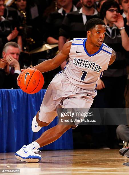 Austin Chatman of the Creighton Bluejays controls the ball against the Providence Friars during the Championship game of the 2014 Men's Big East...