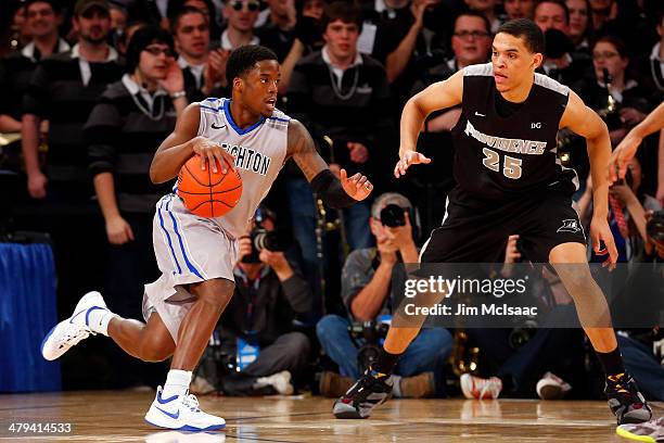 Austin Chatman of the Creighton Bluejays controls the ball against the Providence Friars during the Championship game of the 2014 Men's Big East...