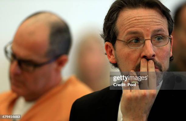 Scott Dekraai , accused of killing eight people in a Seal Beach beauty salon, listens with his attorney Assistant Public Defender Scott Sanders...