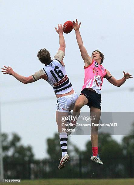 Max King of the Scorpions and Dawson Simpson of the Cats contest the ball in the air during the round 12 VFL match between the Casey Scorpions and...