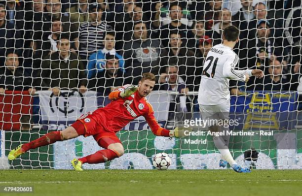 Alvaro Morata of Real Madrid scores his team's third goal past goalkeeper Ralf Fahrmann of FC Schalke 04 during the UEFA Champions League Round of 16...