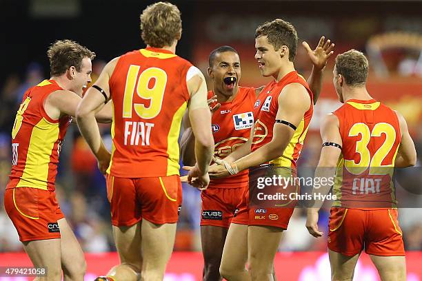 Kade Kolodjashnij of the Suns celebrates a goal during the round 14 AFL match between the Gold Coast Suns and the North Melbourne Kangaroos at...