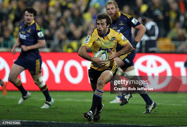 Conrad Smith of the Hurricanes on the attack during the Super Rugby Final match between the Hurricanes and the Highlanders at Westpac Stadium on July...