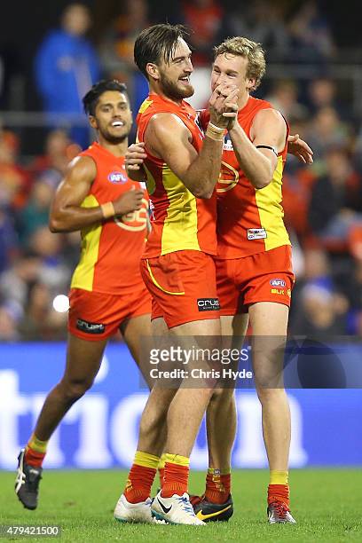 Charlie Dixon of the Suns celebrates a goal during the round 14 AFL match between the Gold Coast Suns and the North Melbourne Kangaroos at Metricon...