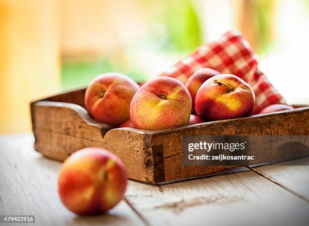 box of nectarines - peach tranquility stock pictures, royalty-free photos & images