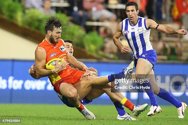 Charlie Dixon of the Suns marks during the round 14 AFL match between the Gold Coast Suns and the North Melbourne Kangaroos at Metricon Stadium on...