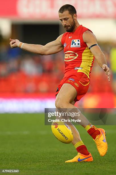 Nick Malceski of the Suns kicks during the round 14 AFL match between the Gold Coast Suns and the North Melbourne Kangaroos at Metricon Stadium on...