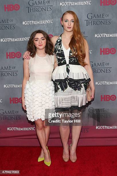 Actresses Maisie Williams and Sophie Turner attend the "Game Of Thrones" Season 4 premiere at Avery Fisher Hall, Lincoln Center on March 18, 2014 in...